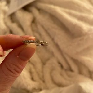 10k white fold wedding band .50tcw and goes 3/4 around